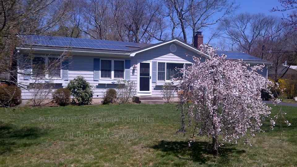 An example of a modest home with solar panels.  