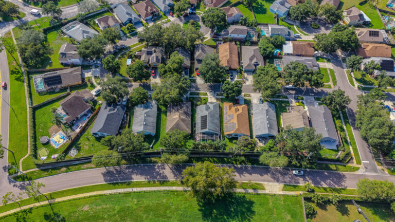 A vibrant aerial view of a suburban neighborhood including solar panels in Florida, USA.