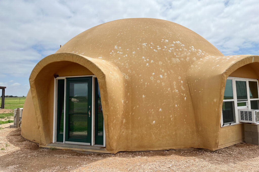 This 1500-square-foot home was hit by baseball-sized hail during a massive thunderstorm. The extended arched augments protected the windows from damage. 