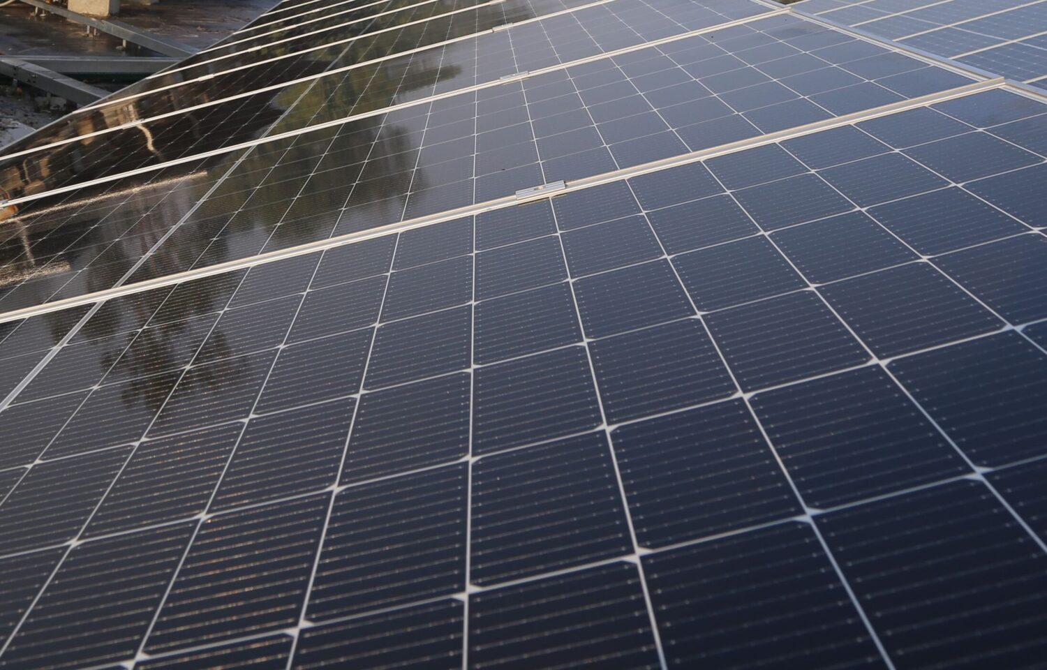 Wide view of solar panels on a rooftop in Lahore, promoting clean energy and sustainability.